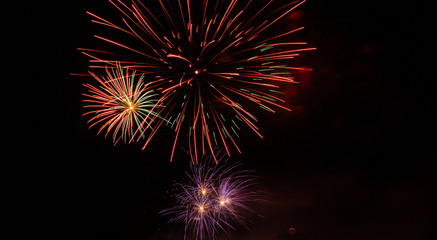 Salute, fireworks in the night sky.