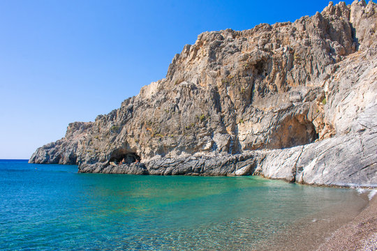 Tripiti beach with colordul sea east Crete. Filakas mountain near to Lendas, Crete Greece. Beautiful landscape sea and mountains. Copy space for text.