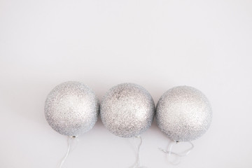 White silver Christmas balls background