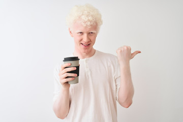 Young albino blond man drinking coffee standing over isolated white background pointing and showing with thumb up to the side with happy face smiling - Powered by Adobe