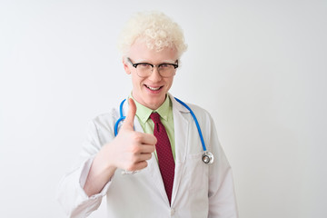 Young albino doctor man wearing stethoscope standing over isolated white background doing happy...