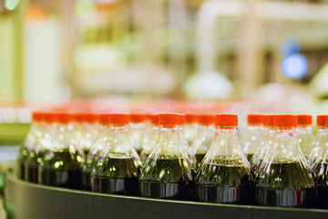 View of plastic bottles at bottling line at soft drinks factory