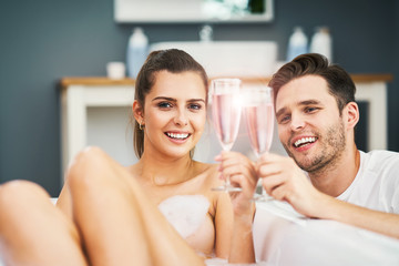 Romantic young couple enjoying and relaxing in the bathtub