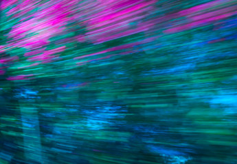 Motion blured coloroful background. Pink, green and blue background with lines.