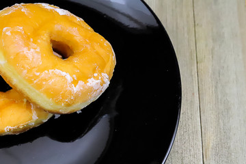 Donuts on black plate 