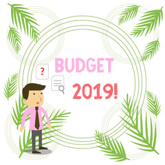 Writing note showing Budget 2019. Business concept for estimate of income and expenditure for current year Young Male Businessman Worker Searching Problem Solution