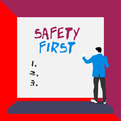 Word writing text Safety First. Business photo showcasing used to say that the most important thing is to be safe Back view young man dressed suit standing platform facing blank rectangle