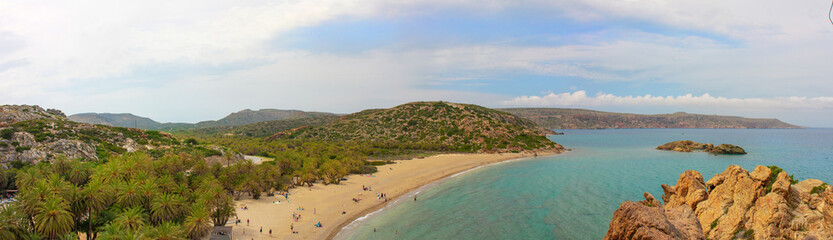 Vai beach, palm forest of Vai in Crete. Famous beach Vai panoramic with a beautiful palm forest. East Crete, Greece. Summer vacations.