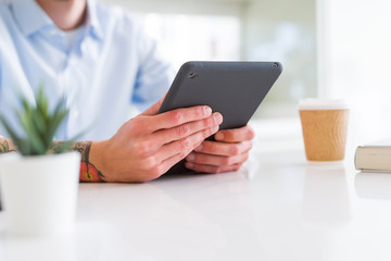 Close up of business man working using touchpad tablet