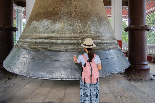 woman travelling with bag visit Mingun Bell located in Mingun, Sagaing Region, near Mandalay and Irrawaddy River. It was the heaviest functioning bell in the world at several times in history.
