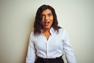 Beautiful transsexual transgender elegant businesswoman over isolated white background afraid and shocked with surprise expression, fear and excited face.