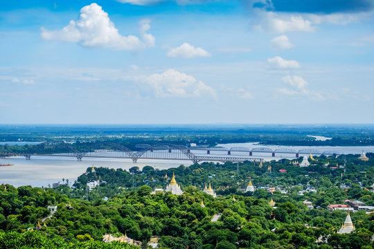 Irrawaddy Bridge or Ayeyarwady, Yadanabon Bridges with Mandalay city, temples, pagoda, Irrawaddy river. View from sagaing hill. landmark and popular for tourists attractions in Myanmar
