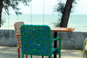 Chair backrest of variety colors of rattan lines that are alternately woven into mesh style