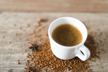 coffee cup served on table with coffee grinder