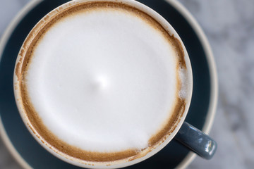 cup of coffee on wooden background
