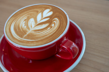 cup of coffee on wooden background