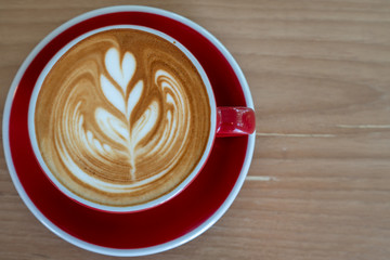 cup of coffee on wooden background