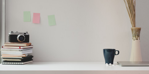 Minimal photographer's workplace with copy space and vintage camera