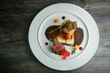 top view on originally decorated medium raw grilled meat pieces
