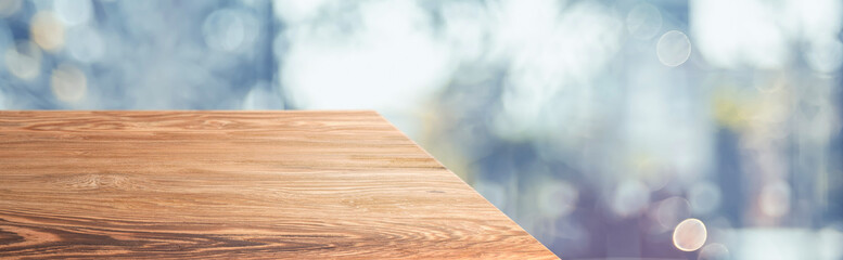 wood table top product display background with blur abstract street light bokeh.left perspective wooden counter with light hallway.Banner mockup presentation for your product on online media