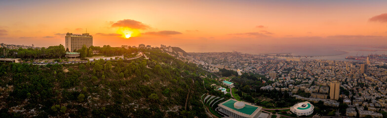 Fototapeta premium Aerial panorama of sunset over Haifa and the Bahai temple complex in Israel