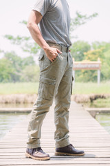 Model wearing sofe green color cargo pants or cargo trousers