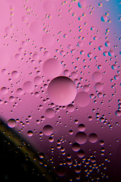 oil bubbles on a water surface with colorful abstract background