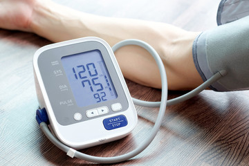 Man check blood pressure monitor and heart rate monitor with digital pressure gauge. Health care...