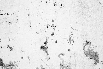 Texture of a concrete wall with cracks and scratches which can be used as a background