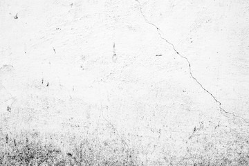 Texture of a concrete wall with cracks and scratches which can be used as a background