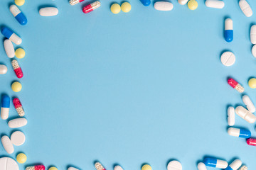 Studio shot of medical pills on blue background