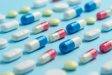 Studio shot of medical pills on blue background