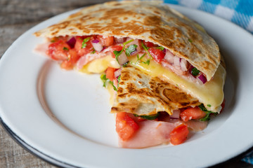 Mexican quesadillas with sliced ham also called 