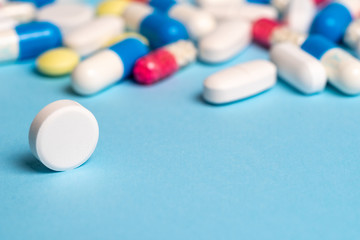 Studio shot of medical pills on blue background