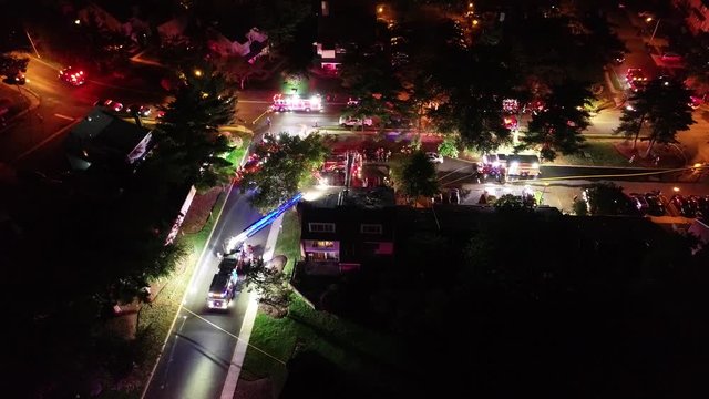 Aerial View of Fire Trucks and Apparatus on Scene of House Fire