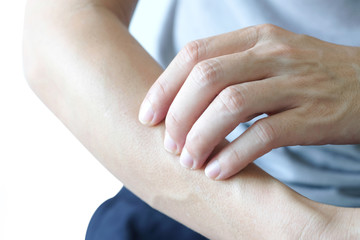 The man's hands he uses his hands to scratch his back because of dermatitis and itch sensation.