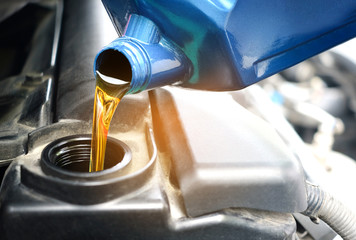 Refueling and pouring oil quality into the engine motor car Transmission and Maintenance Gear...