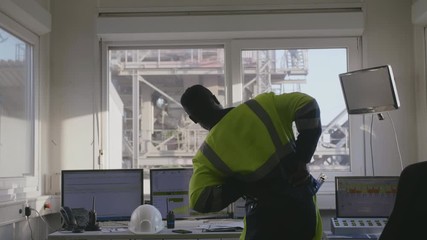 Industrial worker stretching at work - Powered by Adobe