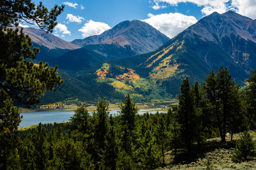 Colorful Rocky Mountain Slopes Rise Above Lake