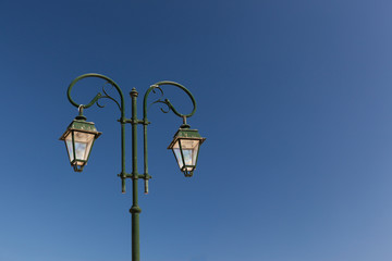 Fototapeta na wymiar street lighting photographed in the old seaside town on a sunny day