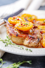 Juicy pork steak with apricots,thyme and potatoes.