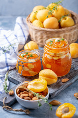 Homemade apricot jam with thyme and sweet almonds.