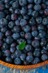fresh blueberries in a wooden bowl