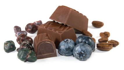 Cookies with chocolate candy and blueberries on a white background closeup.