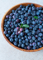 fres blueberries in a bowl on granite surface
