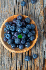 fresh blueberries in a wooden bowl