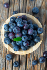 fresh blueberries in a wooden bowl