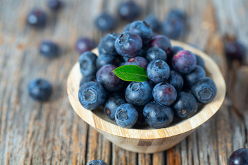 fresh blueberries in a wooden bowl