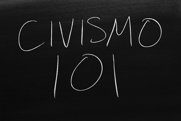 Fototapeta na wymiar The words Civismo 101 on a blackboard in chalk. Translation: Civics 101