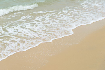 Soft wave at the sea on the sandy beach. Background